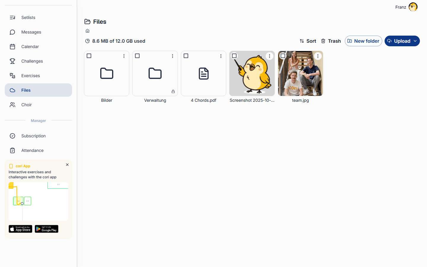 The Files area on the web, with folders, documents and the “Upload” button.